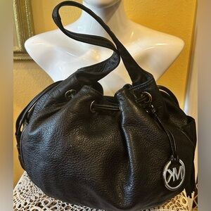 Michael Kors black leather hobo bag large tassels pebble grain gold trim